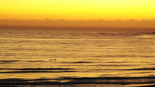 Scenic view of sea at sunset