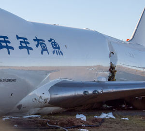 Airplane on runway against clear sky during winter