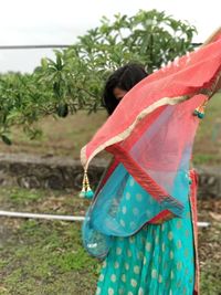 Woman standing in field