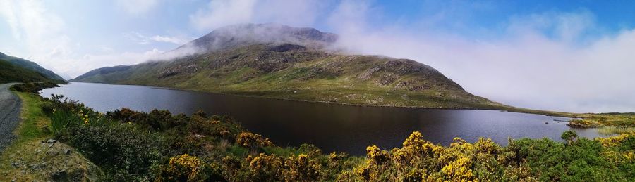 Panoramic view of lake and mountains against sky