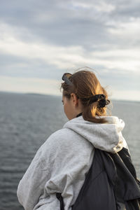 Woman standing at sea