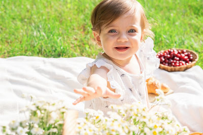 Portrait of cute girl picking flowers