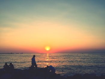 Scenic view of sea at sunset