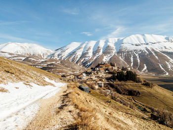 Scenic view of snowcapped mountains against sky