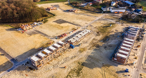 Aerial view of the shell of a large terraced house in a new development area 