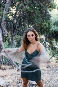 Portrait of young woman in forest