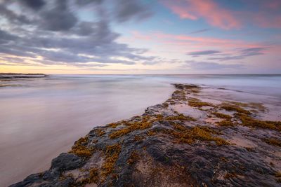 Scenic view of sea against sky during sunset