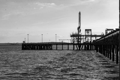 Pier over sea against sky