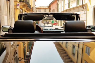 Reflection of the city on a car