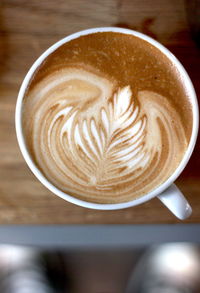 Close-up of cappuccino on table