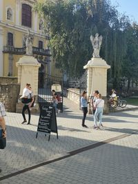 People walking on street in city