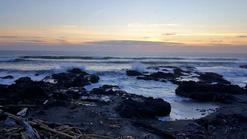 Scenic view of sea against cloudy sky