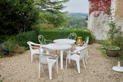 Chairs and tables on table in field