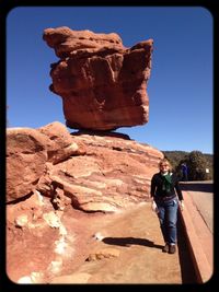 Woman standing on rock formation