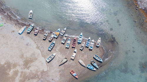 High angle view of boats moored at beach