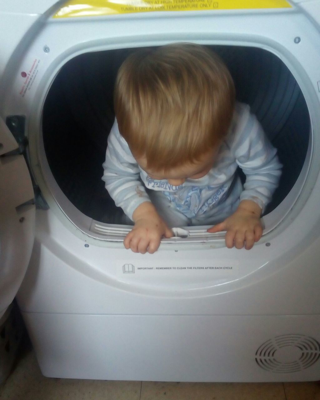 childhood, baby, child, indoors, machinery, people, babies only, washing machine, one person, playing, utility room, day, adult