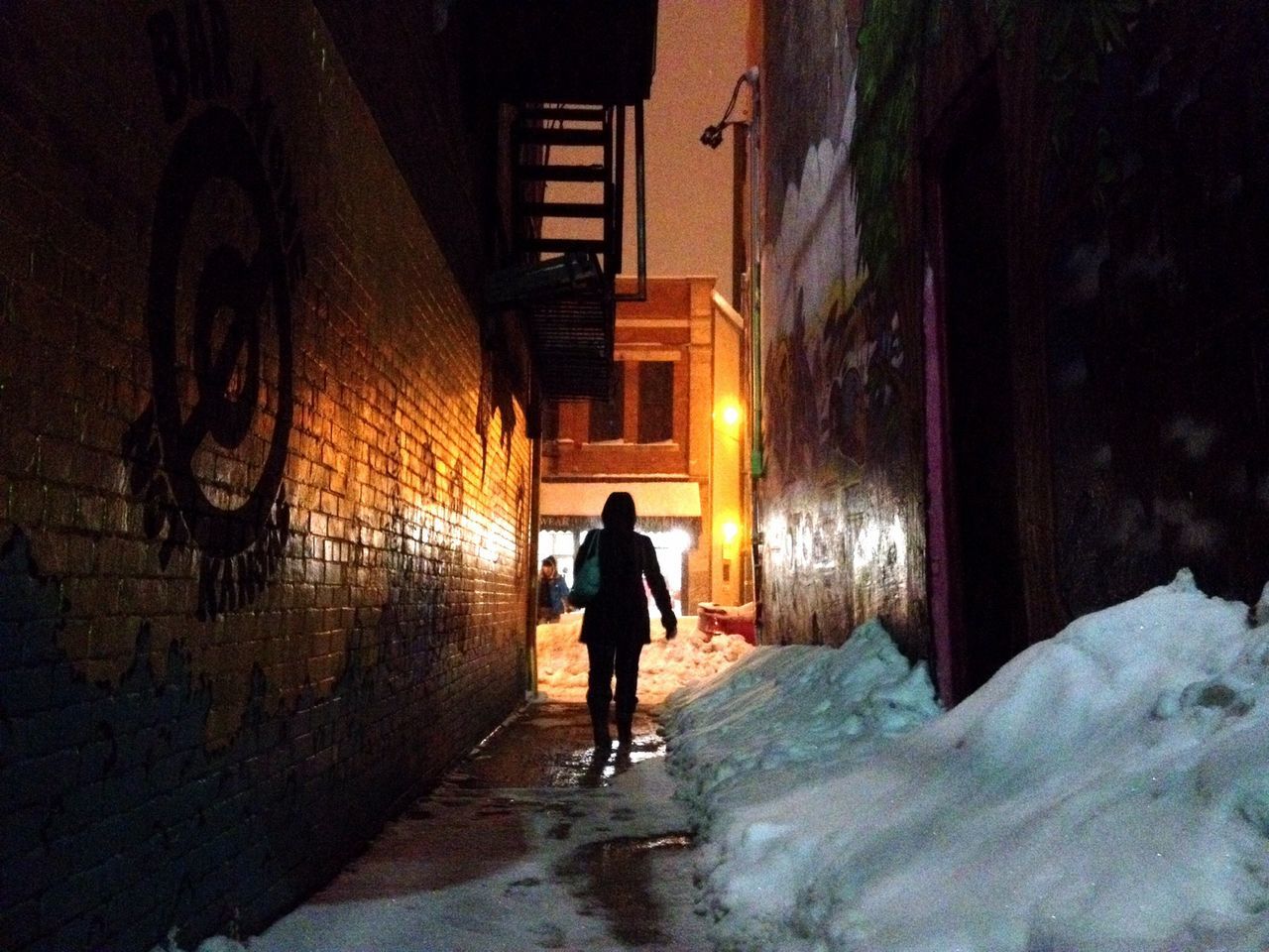 architecture, built structure, full length, building exterior, walking, rear view, illuminated, lifestyles, men, night, wall - building feature, the way forward, tunnel, building, standing, leisure activity, street, graffiti