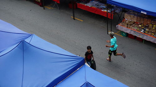 Rear view of people walking on the floor