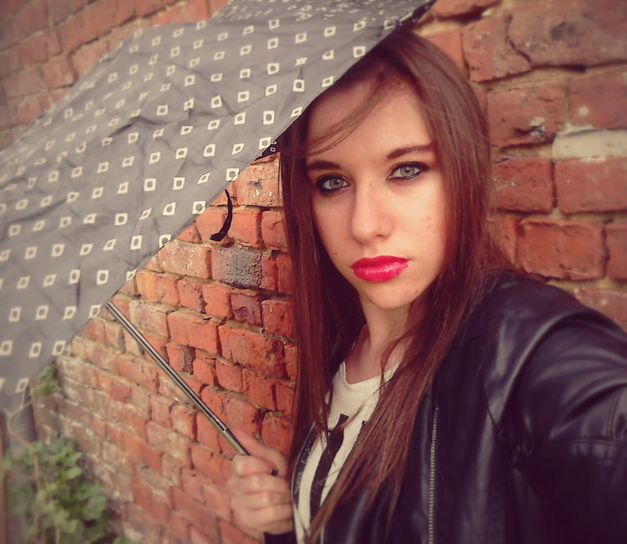 young adult, young women, long hair, portrait, person, lifestyles, looking at camera, front view, wall - building feature, brick wall, leisure activity, casual clothing, black hair, headshot, standing, built structure, smiling