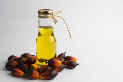 Close-up of fruits in glass jar on table