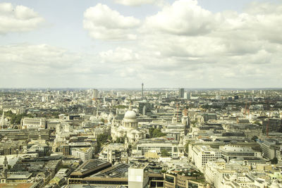 High angle view of city against cloudy sky