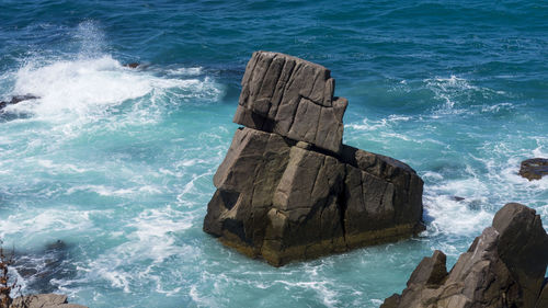 High angle view of rock formation in sea