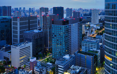 Aerial view of illuminated buildings in city