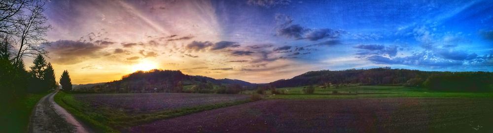 Scenic view of field against sky during sunset