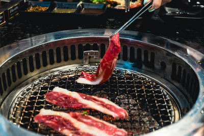 High angle view of meat on barbecue grill