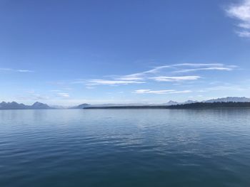 Scenic view of sea against blue sky