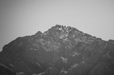 Low angle view of rock formation against clear sky