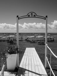 Pier on sea against sky