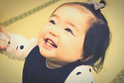 Close-up portrait of cute baby at home