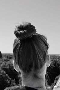 Rear view of woman with hair bun at art museum