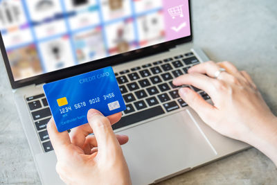 Midsection of person using mobile phone