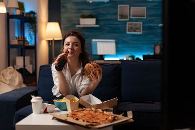 Young woman having food at restaurant