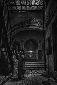 Rear view of man standing in building