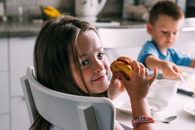 Portrait of cute girl holding food