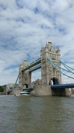 Low angle view of suspension bridge over river