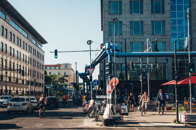 Cars on road against buildings