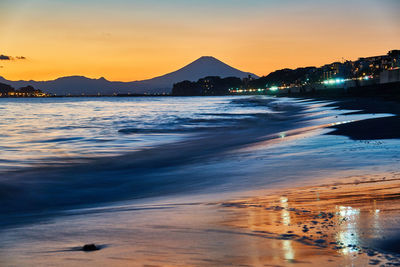 Scenic view of sea against sky during sunset