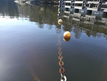 High angle view of rope on lake against building