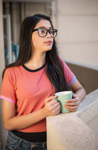 Young woman using mobile phone