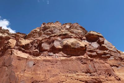 Low angle view of rock formation against sky