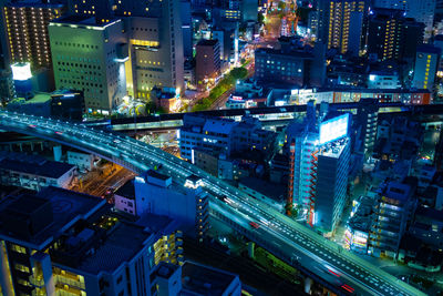 High angle view of illuminated buildings in city at night