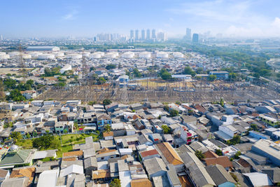 High angle view of buildings in city against sky