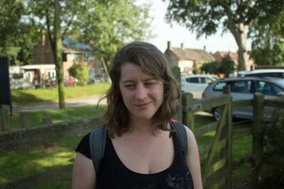 Beautiful woman standing by gate