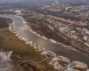 High angle view of river amidst buildings in city