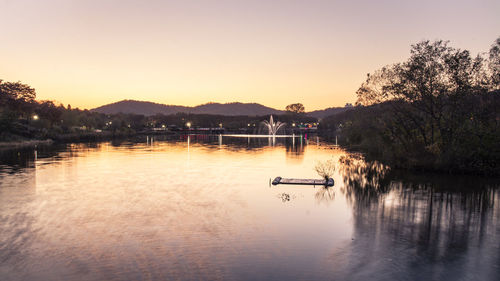 Scenic view of lake against sky during sunset