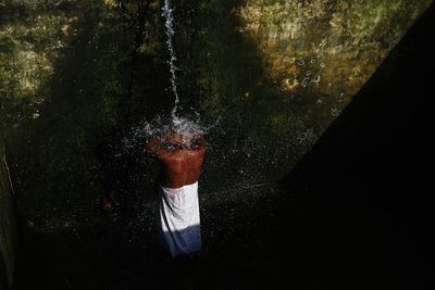 Man swimming in water